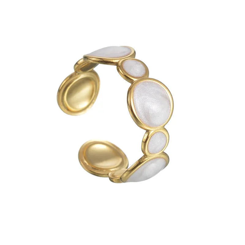 Geometric stainless steel ring for women with an adjustable opening and electroplated finish.