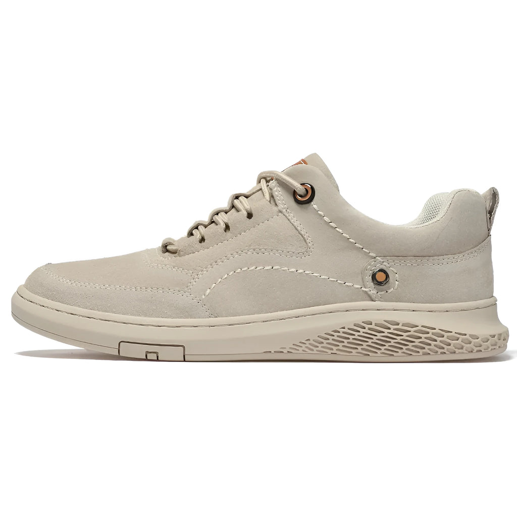 Men's brown leather sports shoes with suede finish and anti-skid plastic sole on concrete background