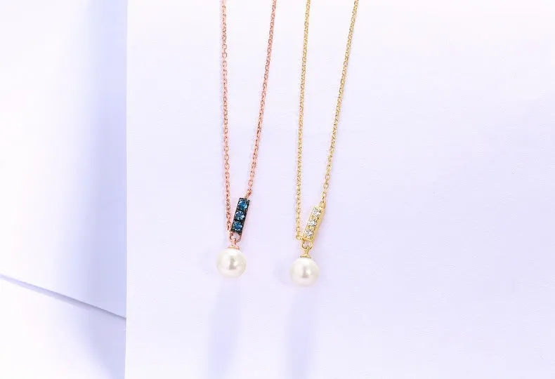 14K rose gold pearl necklace with London Blue stone, 4.5-5MM freshwater pearls, and 420mm adjustable chain.