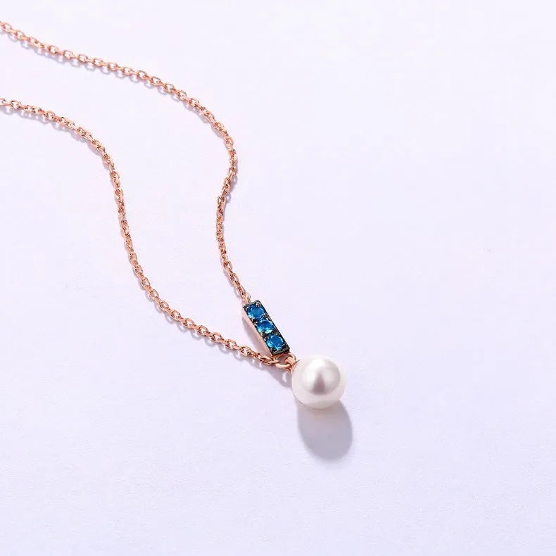 14K rose gold pearl necklace with London Blue stone, 4.5-5MM freshwater pearls, and 420mm adjustable chain.