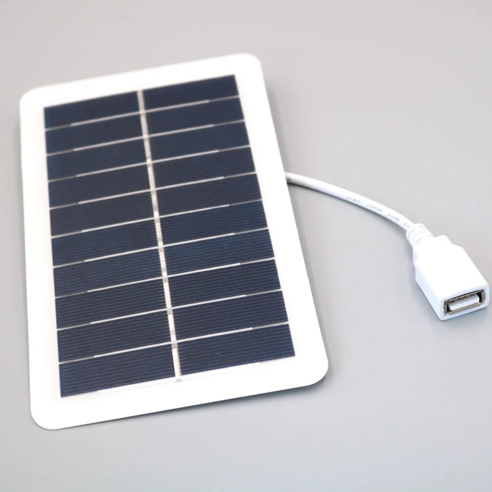 Black solar phone charging panel with USB port showing PET textured surface