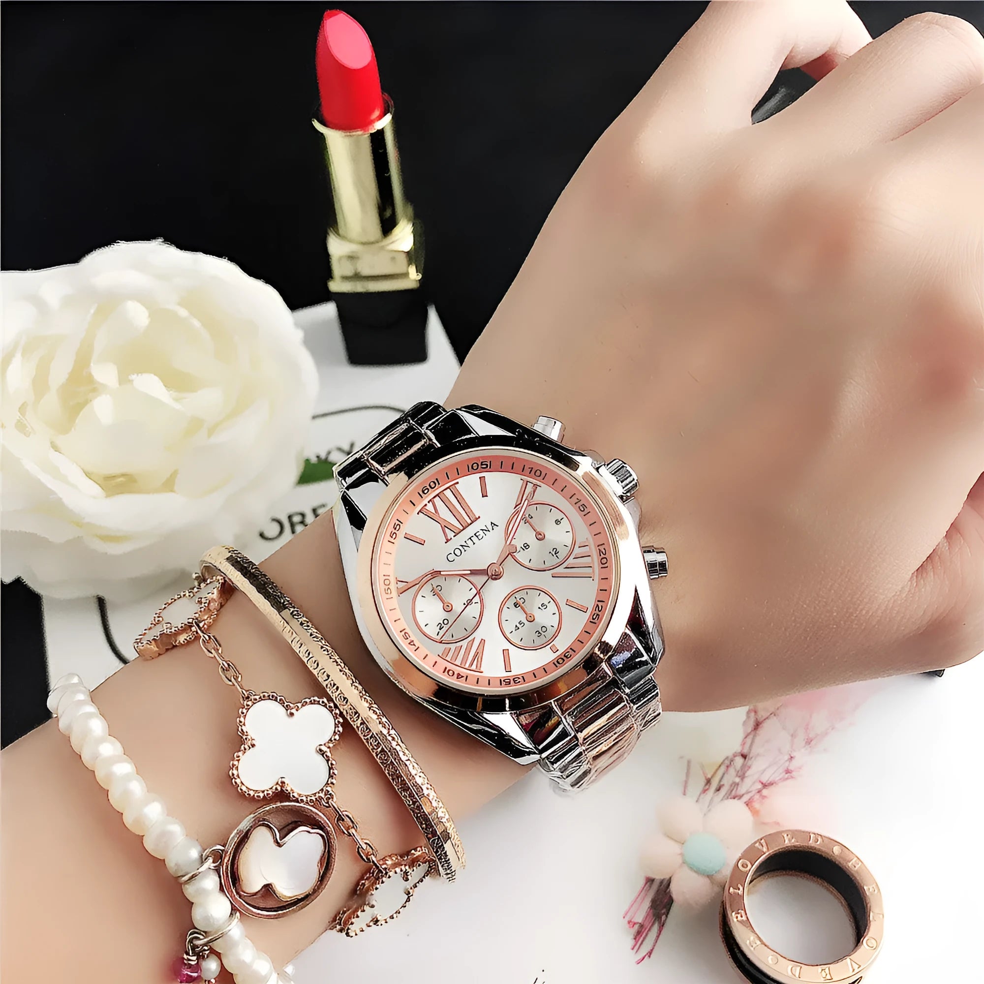 Women's silver rose gold quartz watch with diamond crystal mesh strap and analogue display.