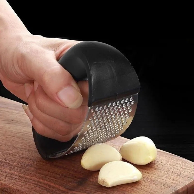 Stainless steel manual garlic press with ergonomic non-slip handle in assorted colours