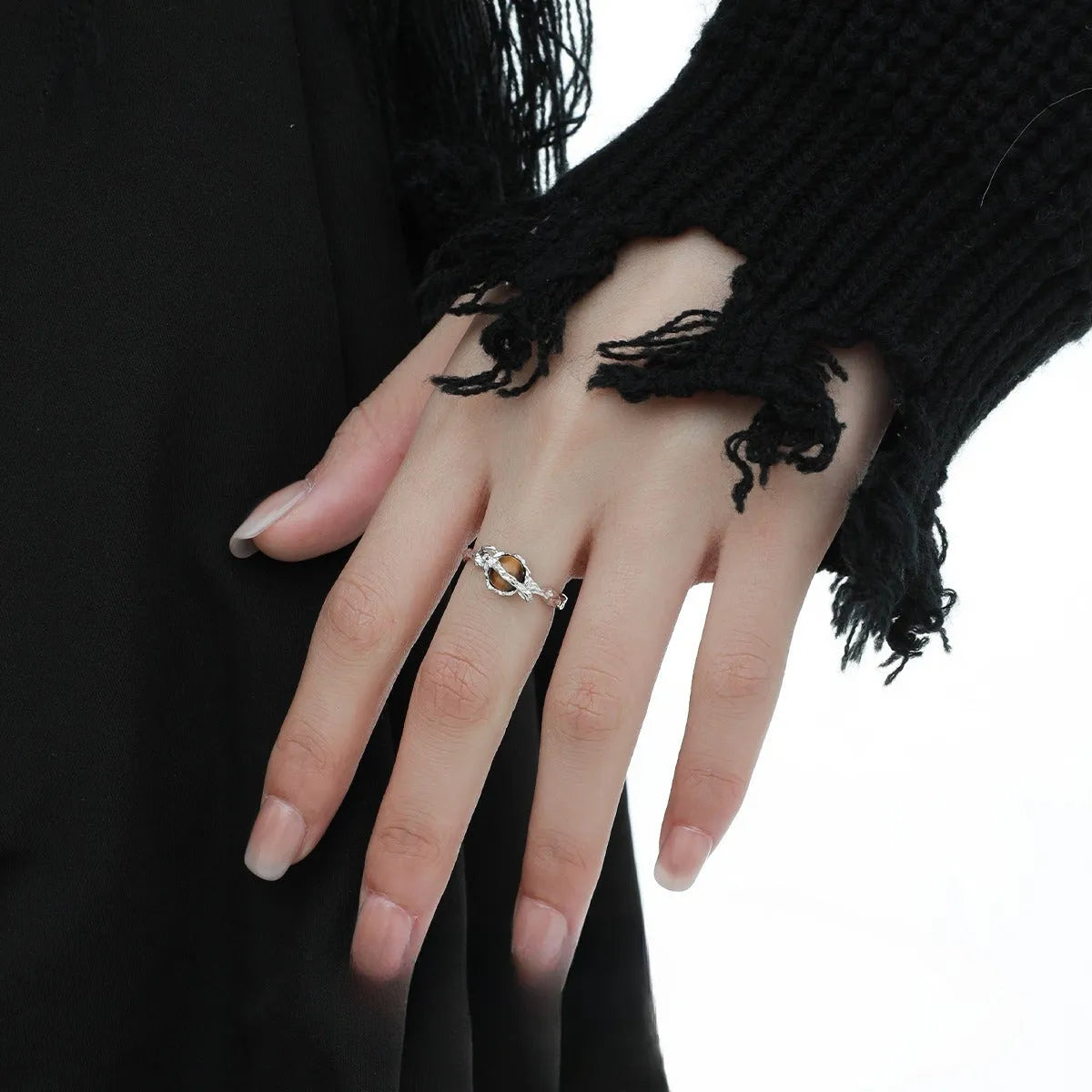 Saturn design adjustable silver ring with white gold electroplated finish and tigereye open pattern