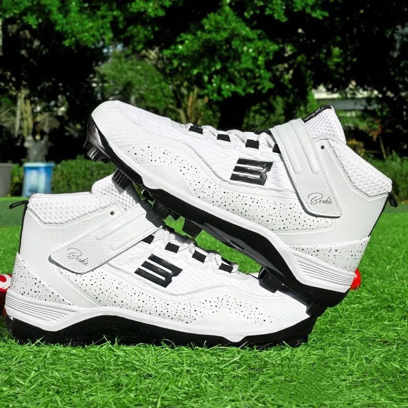 Black and white mid-top sports sneakers with Velcro straps and a textured rubber outsole.