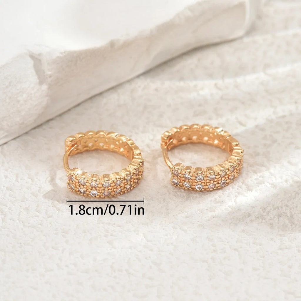Copper geometry pattern ear studs with round, dot, and ring details in colour DE20288.