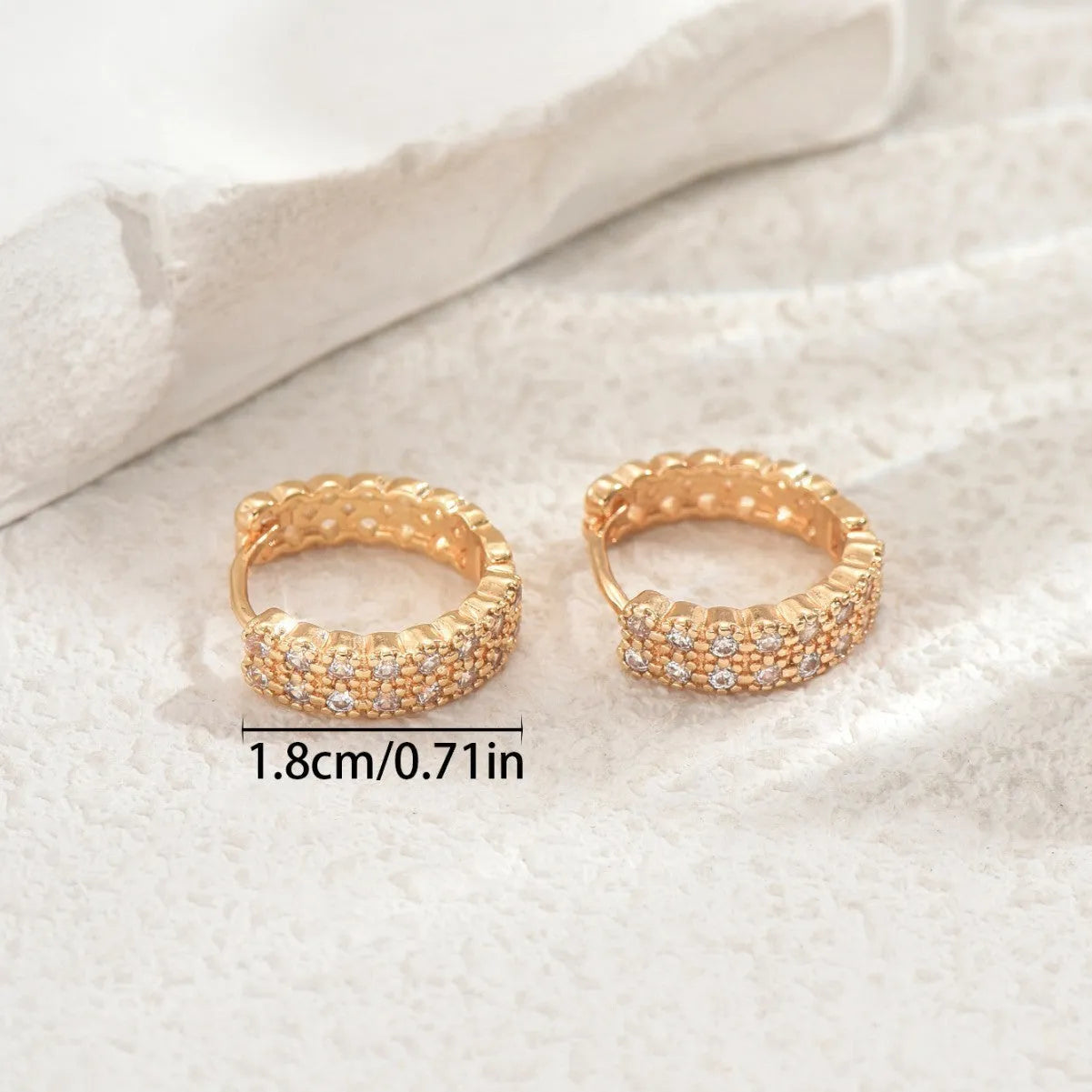 Copper geometry pattern ear studs with round, dot, and ring details in colour DE20288.