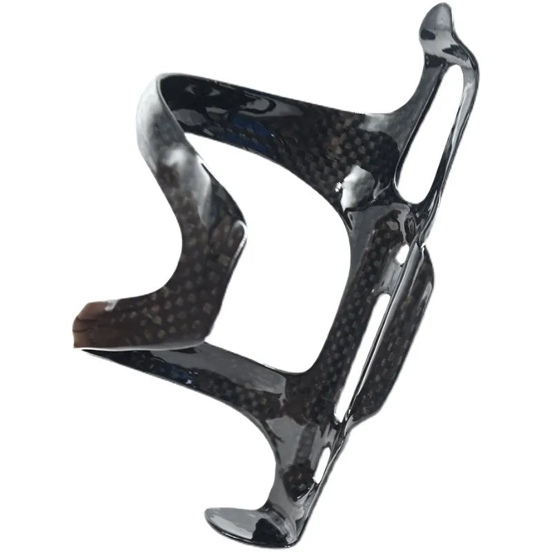 Black carbon fibre side pull bicycle water bottle cage mounted on a bike frame.