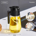 Glass oil sprayer and pour dispenser bottle in beige, yellow, green, or black with ergonomic handle.