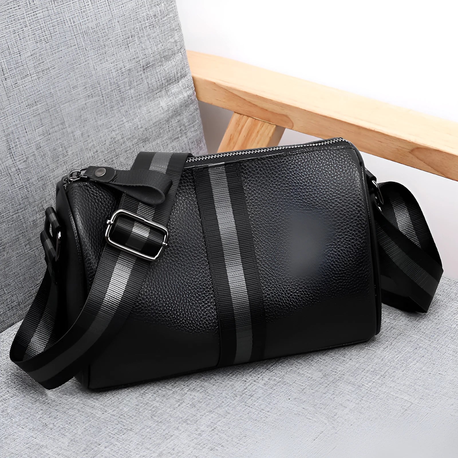 Black genuine leather women's crossbody bag with one-shoulder strap showing 24x16x13cm dimensions
