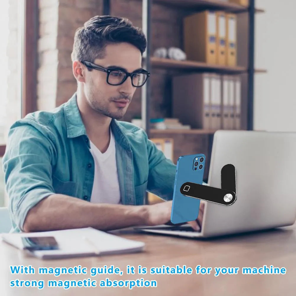 Black aluminum laptop phone holder with magnetic bracket mounted beside computer monitor