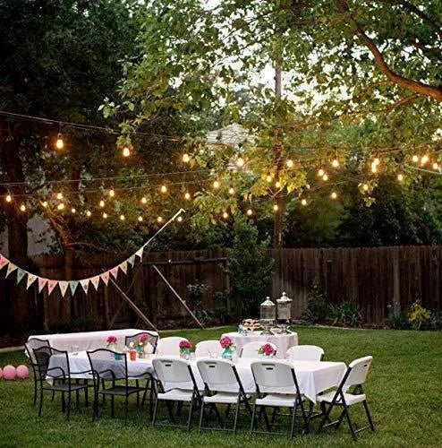 Waterproof outdoor solar string lights with LED bulbs and integrated solar panel for garden illumination