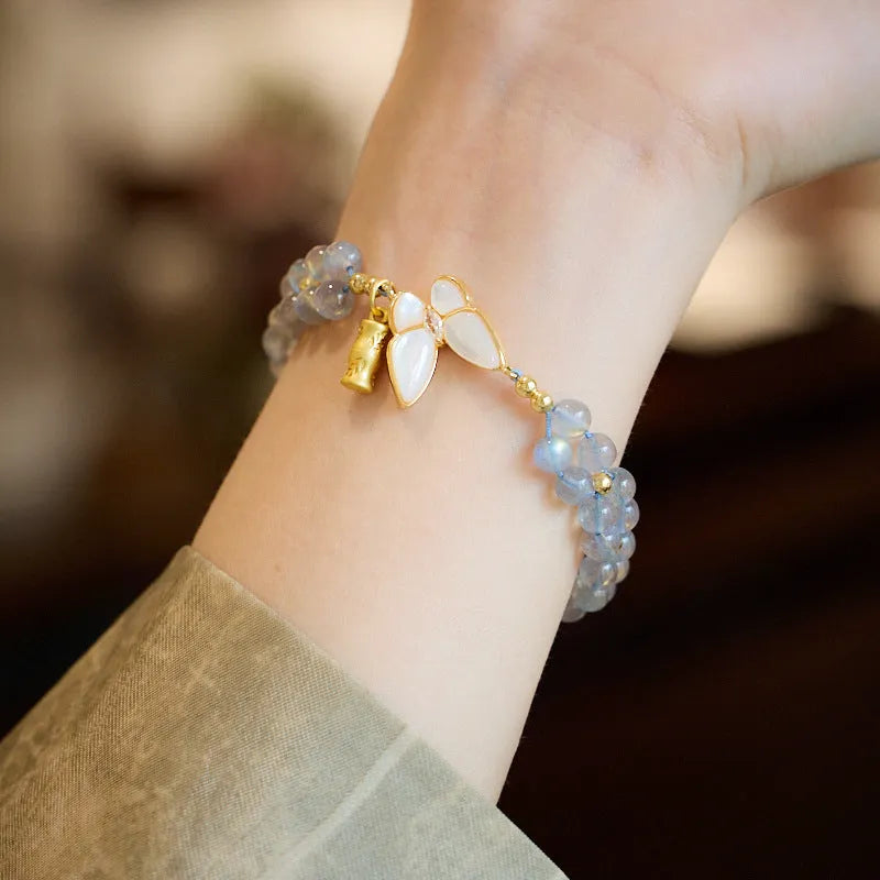 Grey moonstone woven bracelet for women with geometric design and butterfly detailing