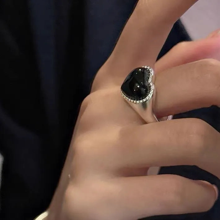 Adjustable sterling silver ring with heart-shaped black agate in open-mouth design