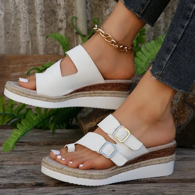 White patent leather wedge sandals with woven upper and peep toe design