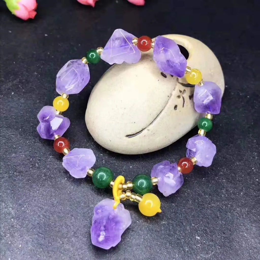 Purple natural shaped amethyst bead bracelet for women with a fu character charm.