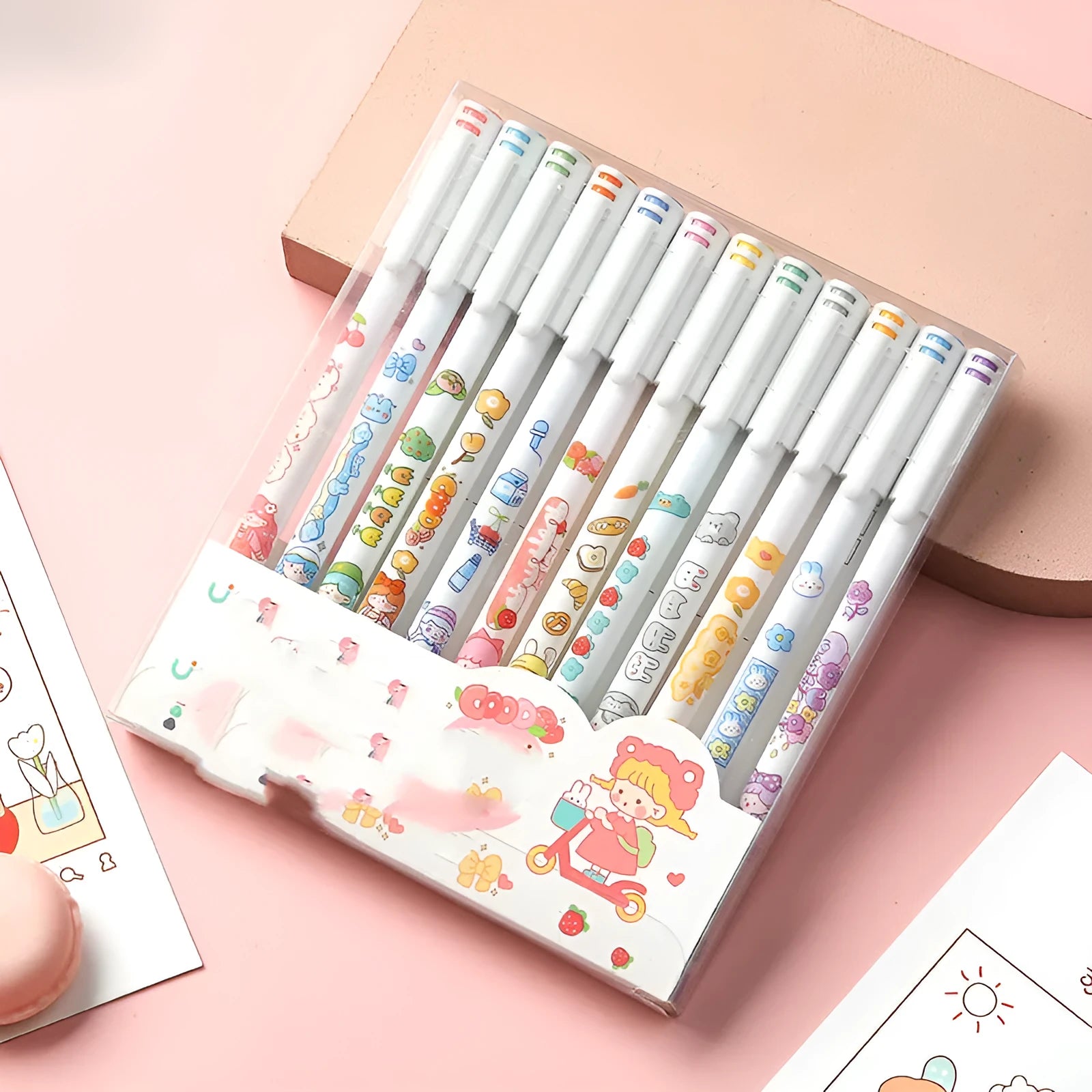 Twelve coloured cartoon-design gel pens with 0.5mm tips arranged in set