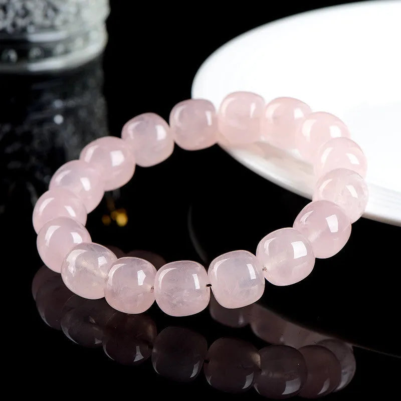 Pink crystal barrel bead bracelet with geometric design, 11-12mm beads, unisex accessory