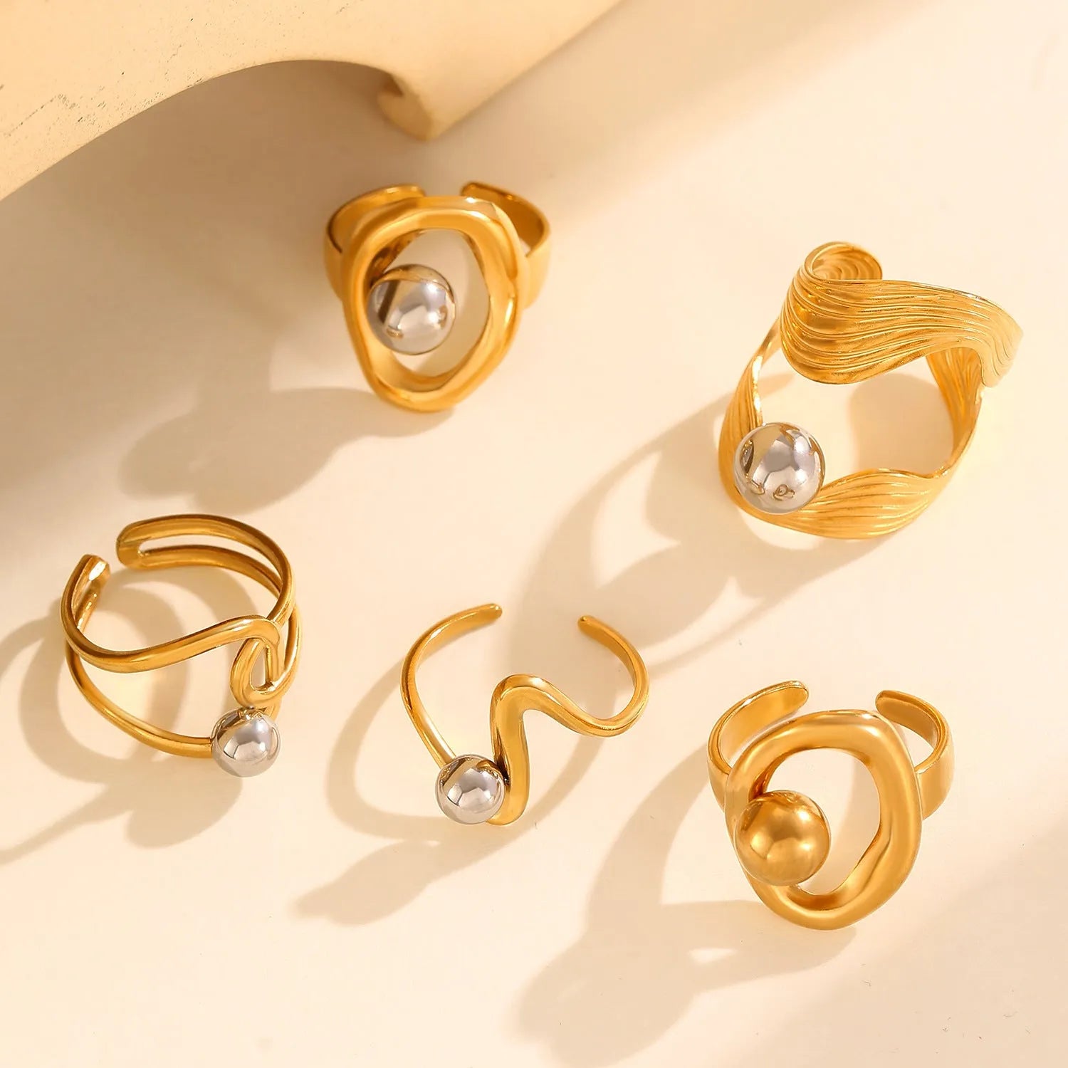 Stainless steel geometric open ring with 18K real gold finish and hollow line detail