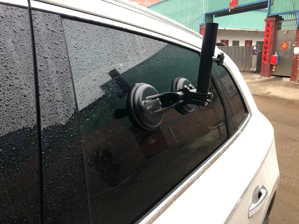 Black off-road car windscreen sucker mount with a large round rubber suction cup for flagpoles.