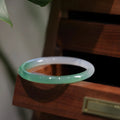 Chalcedony jade bracelet showing natural stone patterning with size measurement indicators