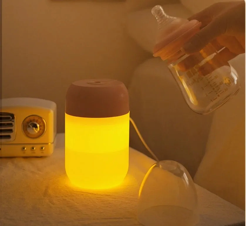 Small white cylindrical USB-powered humidifier for silent bedroom and desk use.