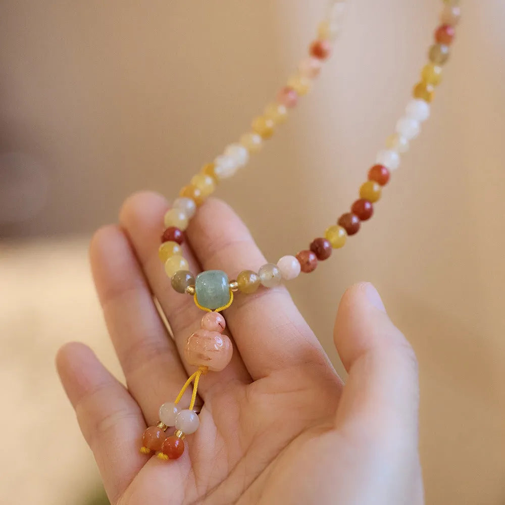 Women's handcrafted three-circle pumpkin jade bracelet with gold tassels