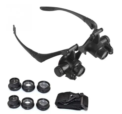 Black double eye magnifier glasses with LED lights and multiple lenses for hands-free watch and electronic repair.