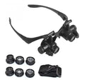 Black double eye magnifier glasses with LED lights and multiple lenses for hands-free watch and electronic repair.