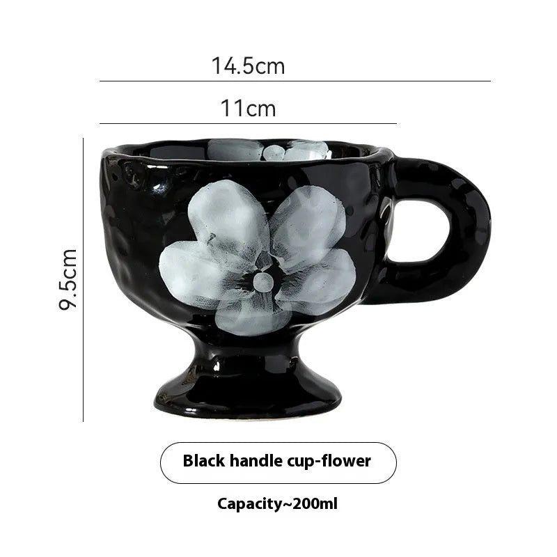 Hand-pinched irregular ceramic mug in a solid colour, showing its unique shape.