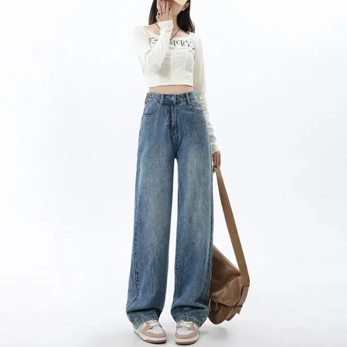 Woman wearing high-waisted retro blue wide leg jeans with a straight-leg cut.