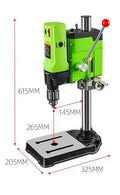 Mini bench drill and milling machine on a workbench with bench pliers.