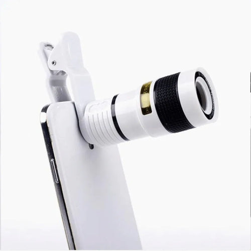 12X magnification phone telescope lens with attachment clip on a mobile phone.