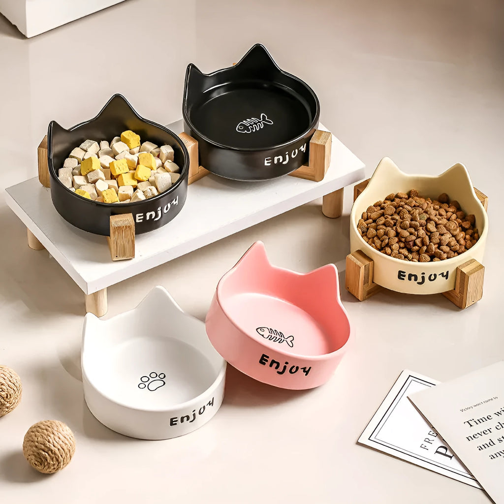 Porcelain cat bowl with wooden frame featuring cat paw pattern in pink colour