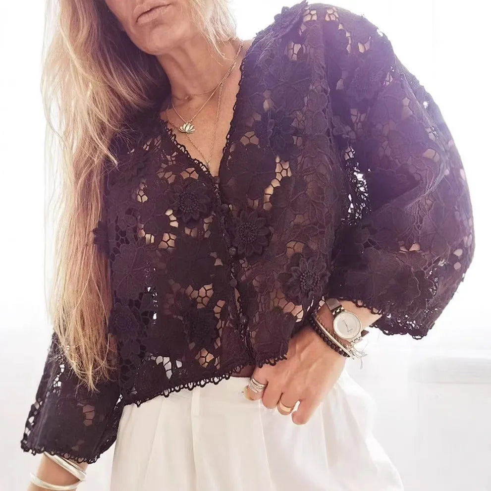 Women's loose-fitting lace cardigan with 3D floral decoration and V-neck in black.