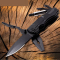 Black multi-purpose folding pliers tool with 7.5cm blade and aluminium handle on a flat surface