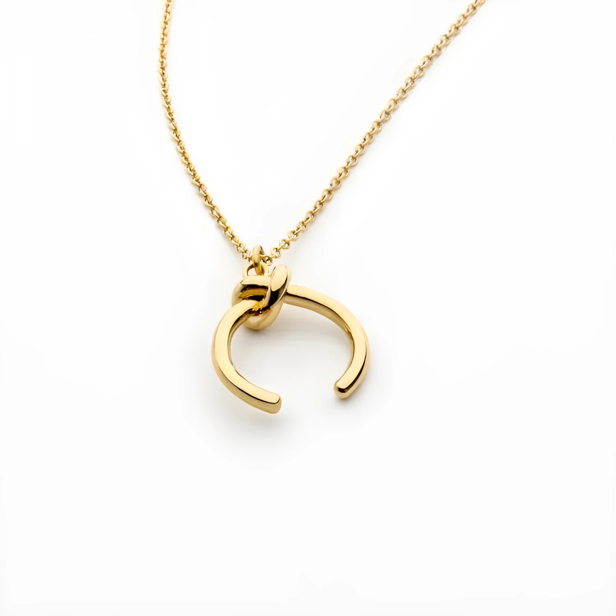 A vintage-style geometric pendant necklace with an adjustable copper chain in a gold finish.