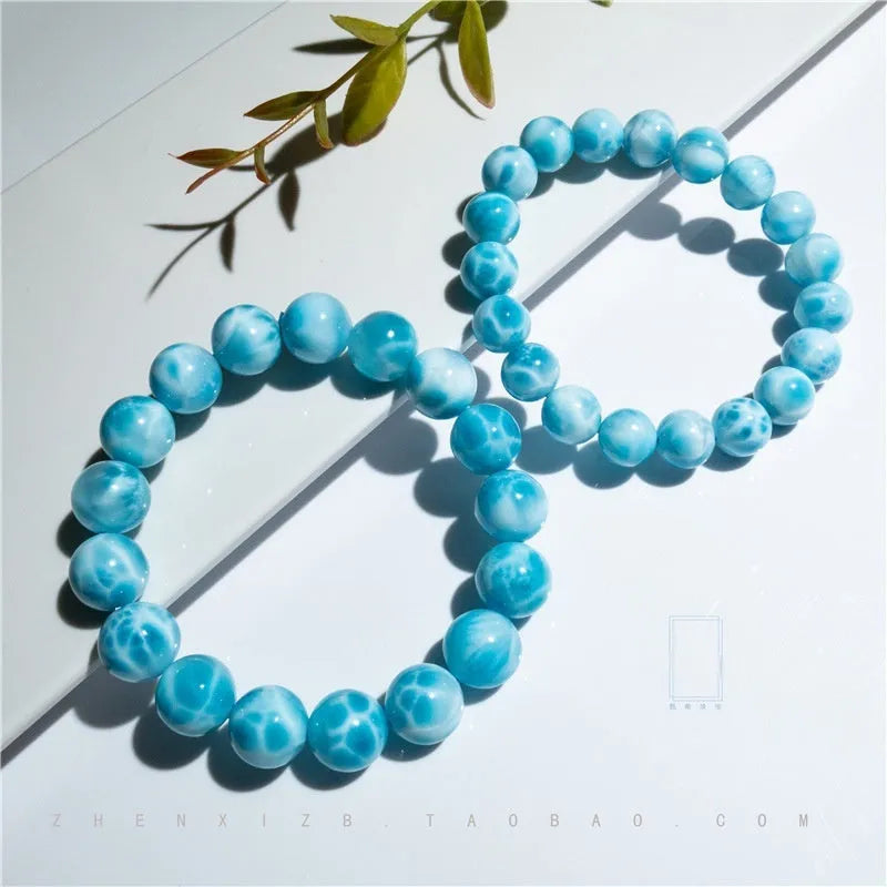 Blue unisex Bodhi bracelet with natural crystal sea-pattern stones and pearls in Maillard style.