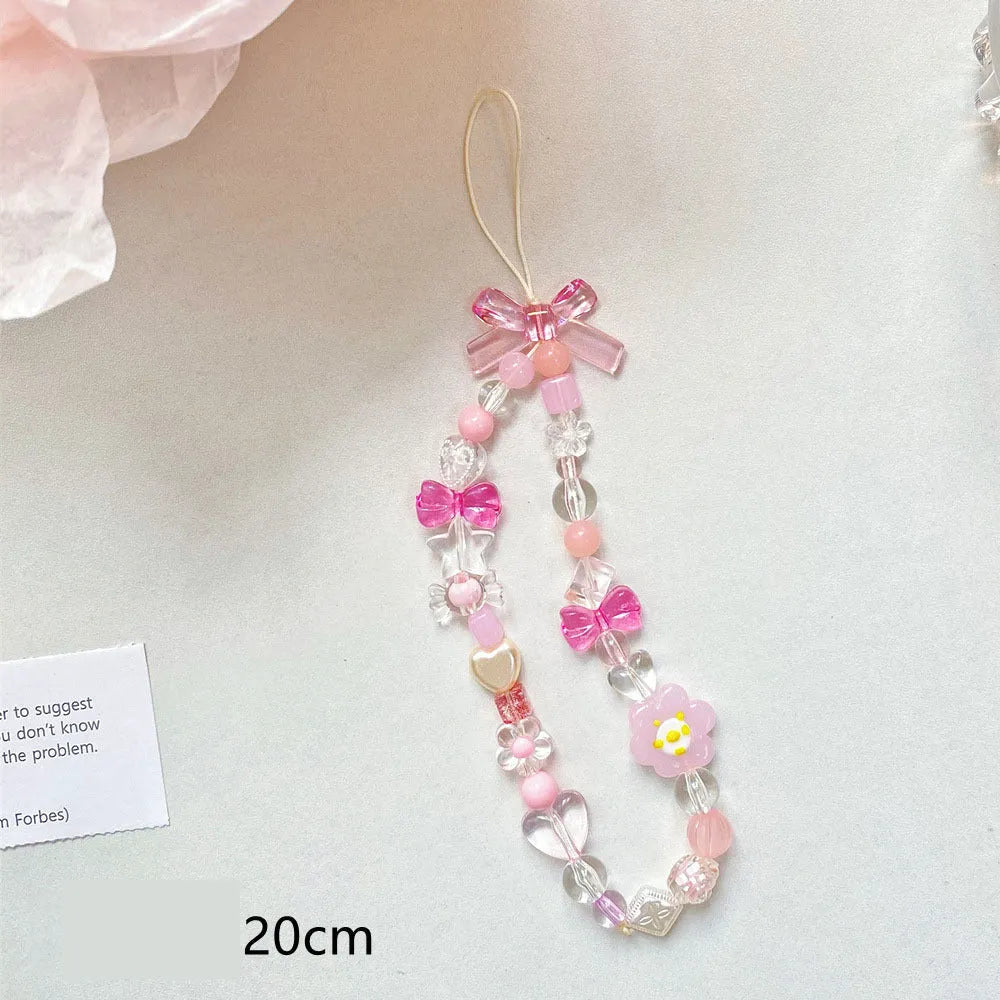 Close-up of a blue flower beaded phone lanyard with a rope strap for carrying mobile phones.