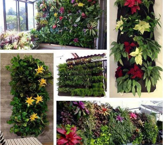 Vertical felt wall garden planter with multiple green planting pockets hung on a wooden fence