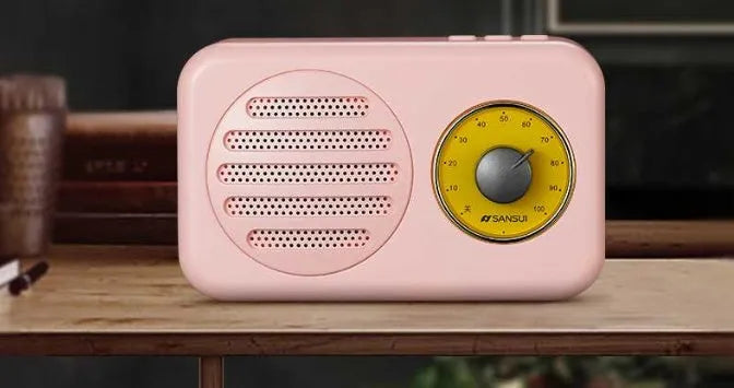 Portable Bluetooth speaker with FM radio in wood colour finish showing front speaker grille and control buttons