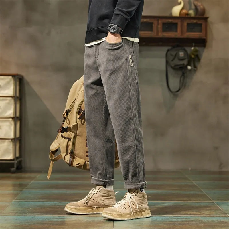 Corduroy men's casual trousers in street fashion style with straight leg opening and tapered cut