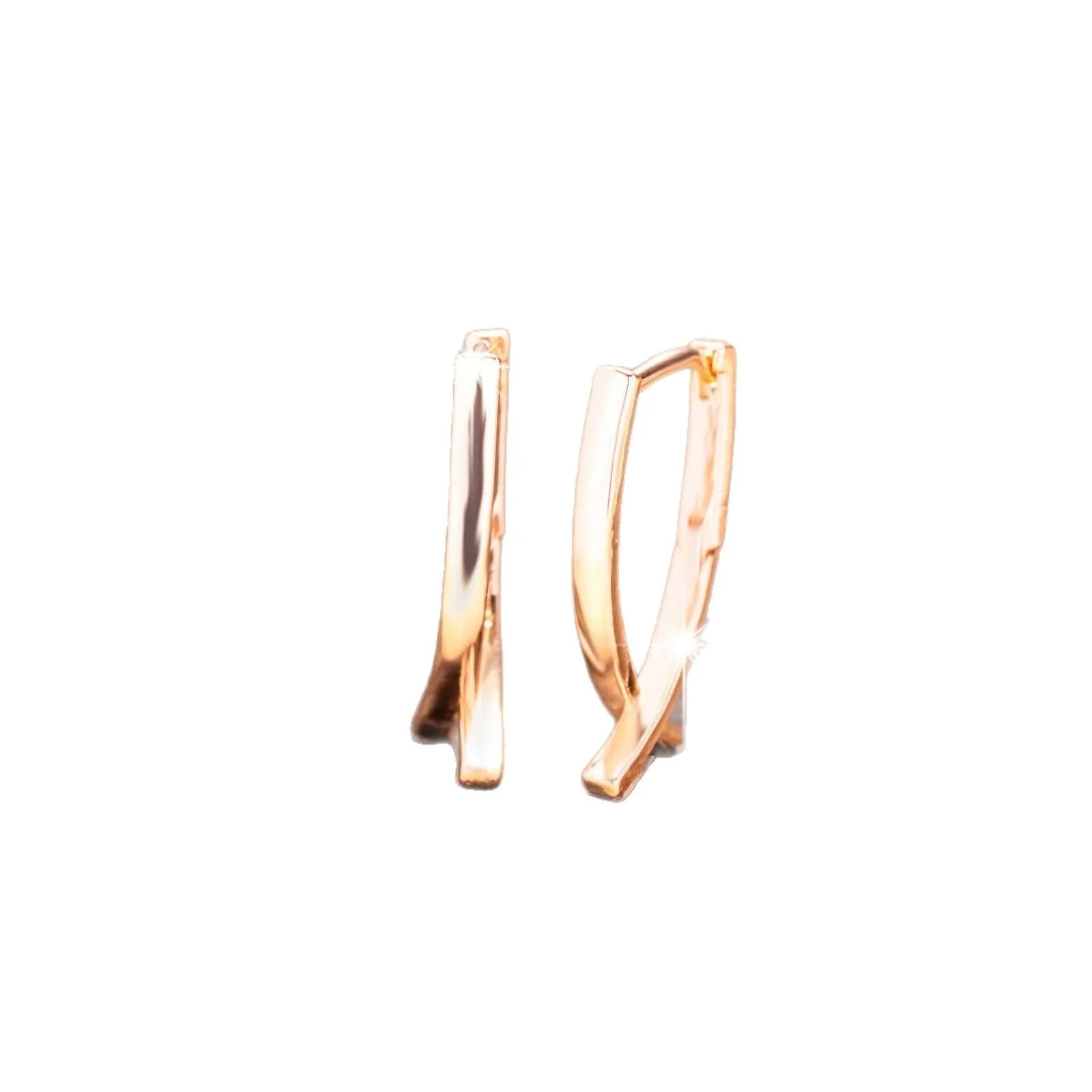 Rose gold cross shaped earrings on a copper base, light luxury style