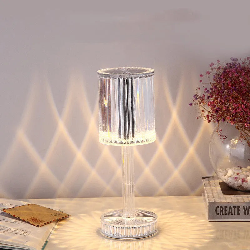 Modern crystal table lamp with touch dimming base and transparent K9 crystal bead lampshade on a nightstand.