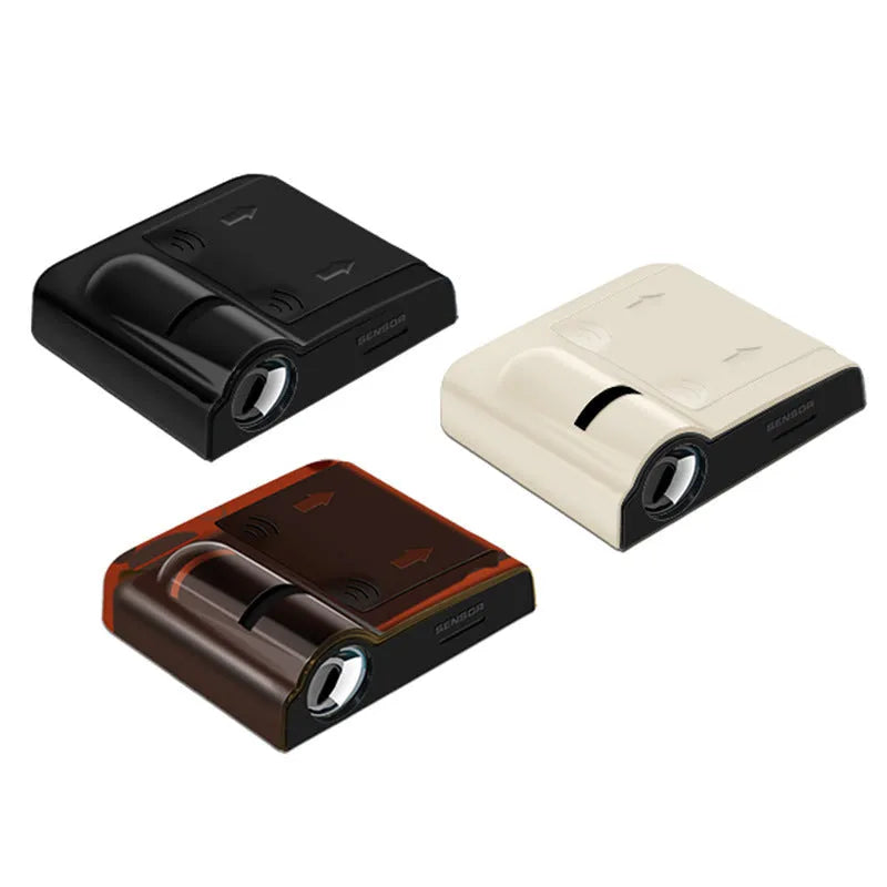 Compact black and beige ABS plastic car decorative projection radium lamp shown with AA batteries.