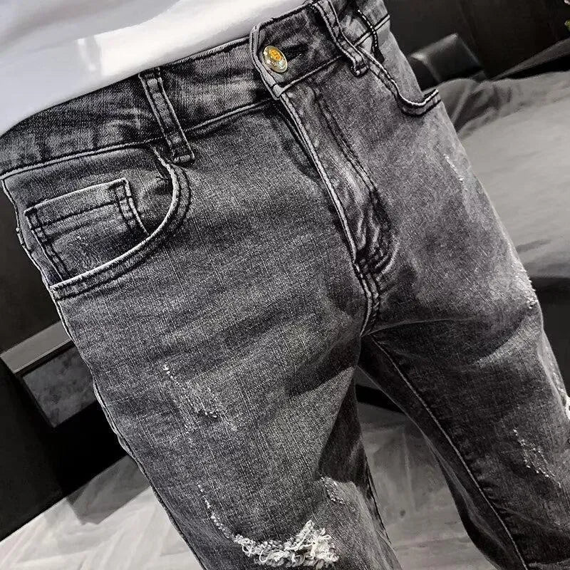 Men's blue denim jeans with high waist, button fly, and straight leg design on hanger