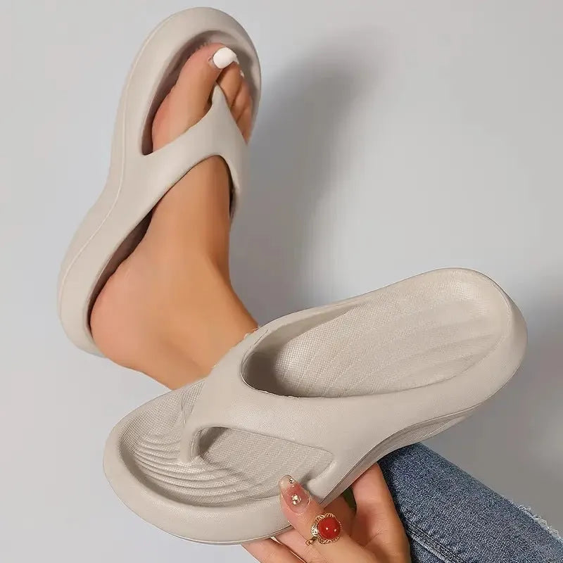 Women's black EVA flip flops with thick sole and textured footbed, shown from above.