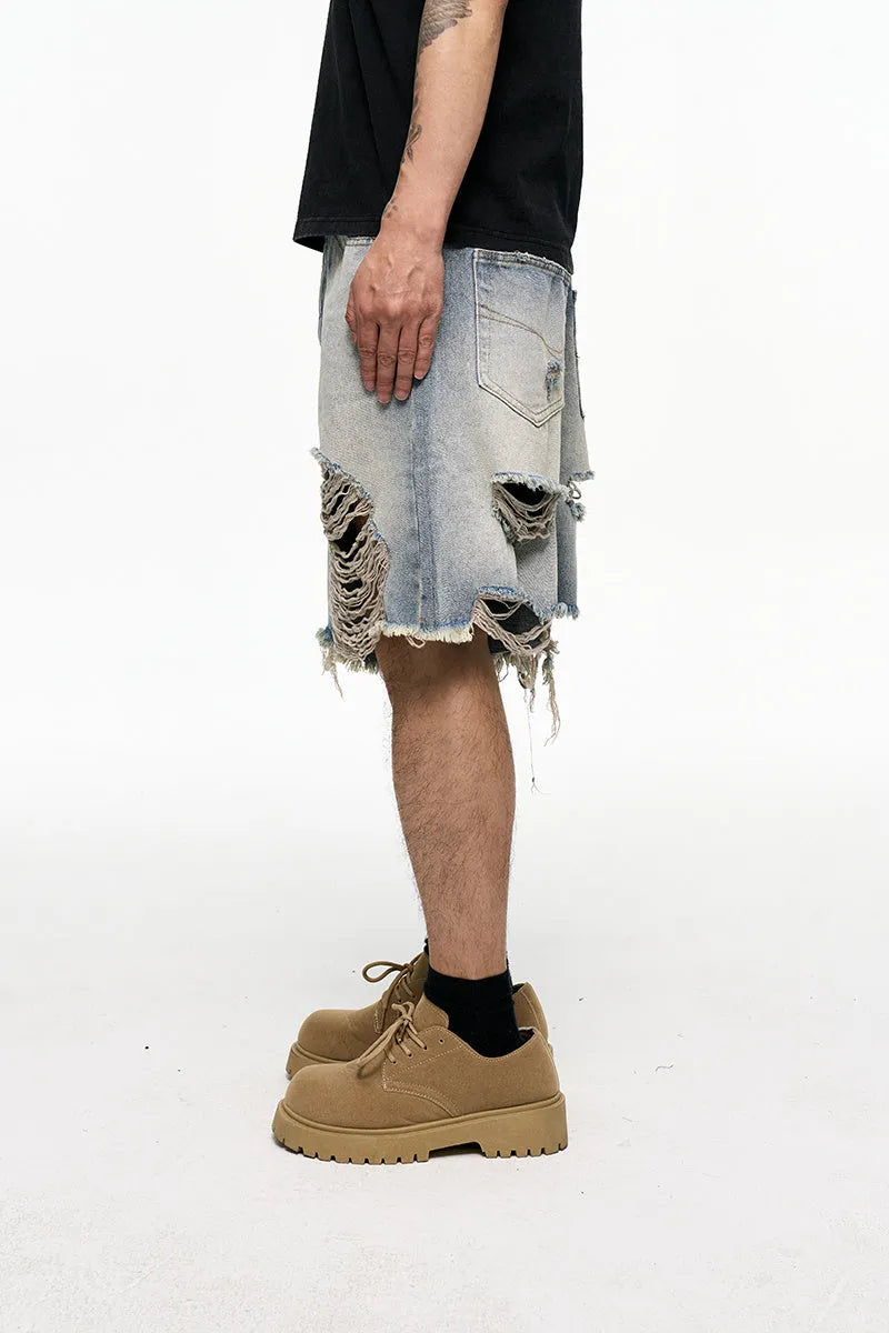 Men's light blue baggy denim shorts with wide leg cut and zip fly