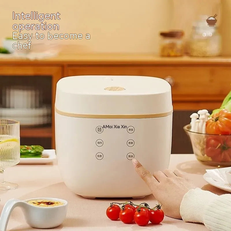 White or beige 3L rice cooker with black inner pot, rice scoop, measuring cup and steamer basket