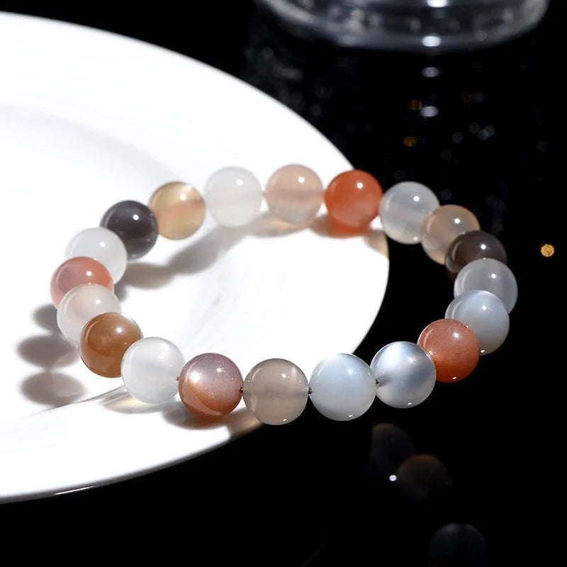 Natural moonstone Duobao bracelet with 8mm beads showcasing a colourful moonlight effect on an adjustable band.